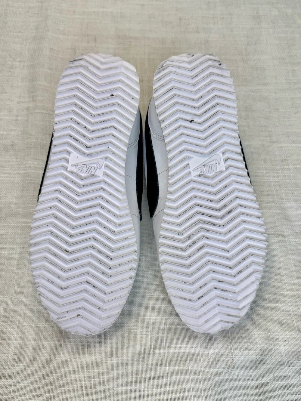 Nike Kids White Sneakers with Black Swoosh